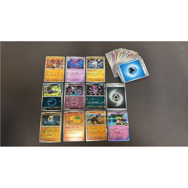 STACK OF ASSORTED POKEMON CARDS