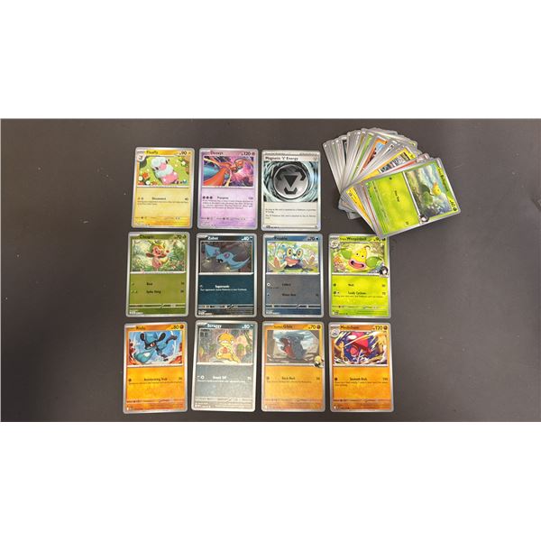 STACK OF ASSORTED POKEMON CARDS