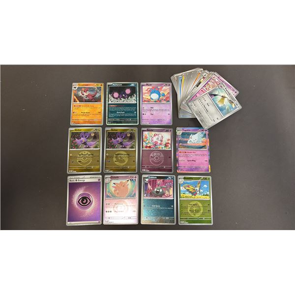 STACK OF ASSORTED POKEMON CARDS