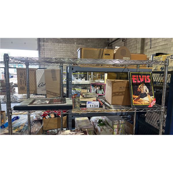 SHLEF OF ASSORTED ELVIS PRESLEY COLLECTABLE ITEMS INCLUDING MUSICAL POP UP BOOKS, CDS AND MORE