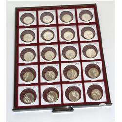 Sterling Silver Antique Car Medallions in Display