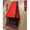 Image 10 : Wall-Mounted Red Metal Fireplace with Decorative Crest and Matching Sword Plaques