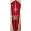 Image 4 : Wall-Mounted Red Metal Fireplace with Decorative Crest and Matching Sword Plaques