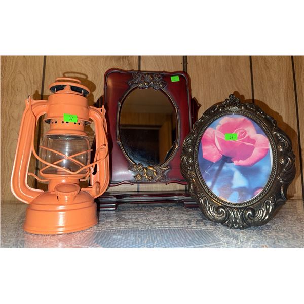 Decorative Lantern, Ornate Oval Photo Frame, and Wood Vanity Mirror Trio