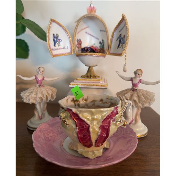 Porcelain Ballerina Figurines, Hand-Painted Decorative Egg, and Ornate Teacup with Saucer