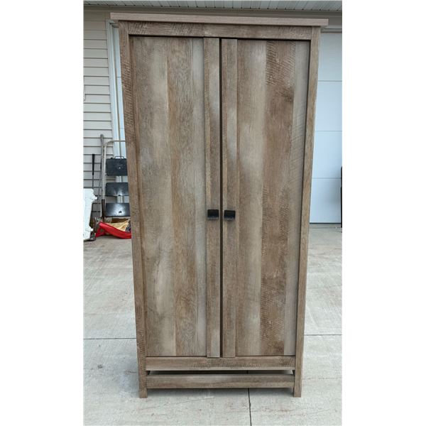 SAUDER CANNERY BRIDGE STORAGE CABINET IN A LINTEL OAK FINISH