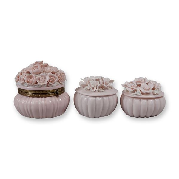 A Trio of Pink Porcelain Floral Encrusted Trinket Boxes