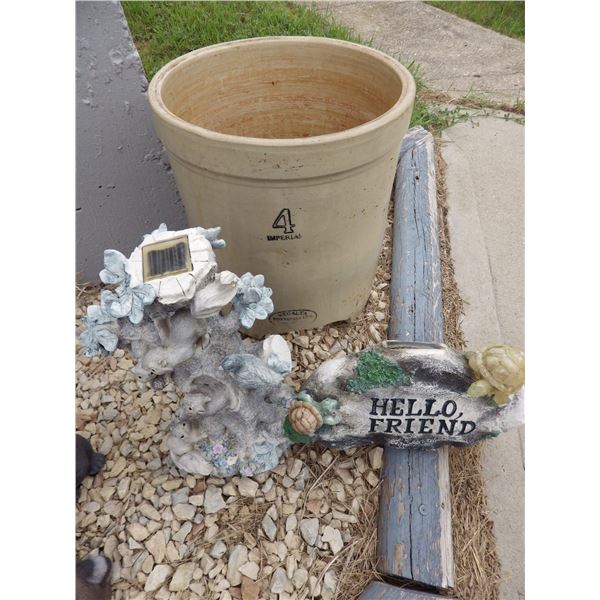 lawn ornaments and damaged 4 gallon crock
