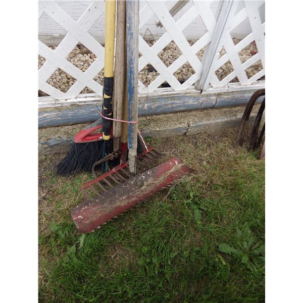 bundle of assorted garden tools