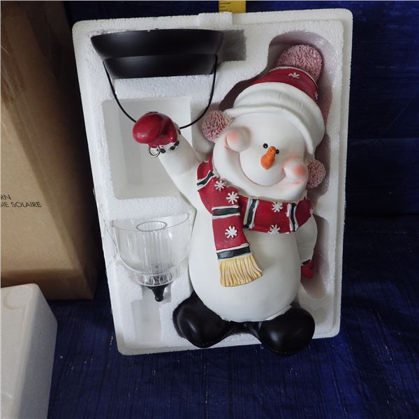 snow man with solar powered Lantern