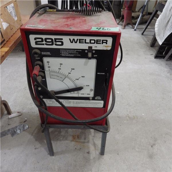 Century 295 Arc Welder on mobile stand with welding cable and helmets