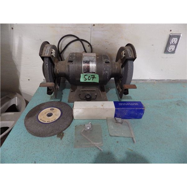 Three quarter bench grinder with extra grinding wheels and grinding wheel dresser