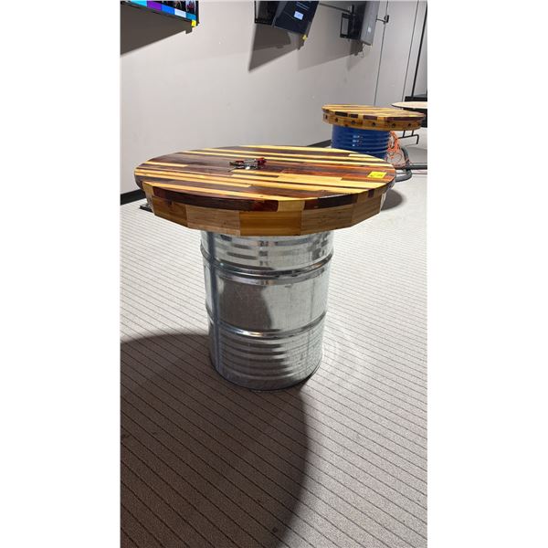 39" DIAMETER WOODEN TABLE TOP ON SILVER 50 GALLON BARREL DRUM - APPROX. 3FT HIGH