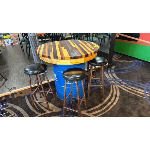 39" DIAMETER WOODEN TABLE TOP ON BLUE 50 GALLON OIL DRUM W/4 STOOLS - APPROX. 3FT HIGH
