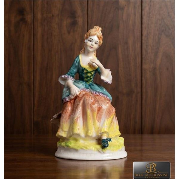 Hand-Painted Porcelain Figurine of Seated Lady