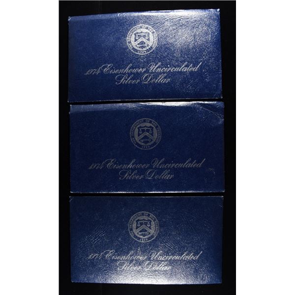 (3) 1974 EISENHOWER DOLLAR BLUE PACKAGING