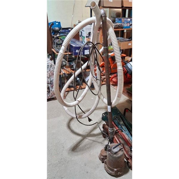 USED SUMP PUMP WITH HOSE