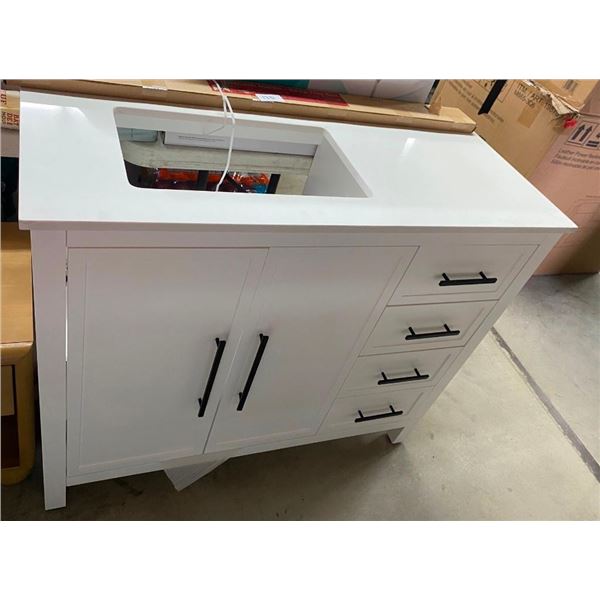 42IN VANITY - TOP IS CRACKED AND ONE HANDLE IS BENT
