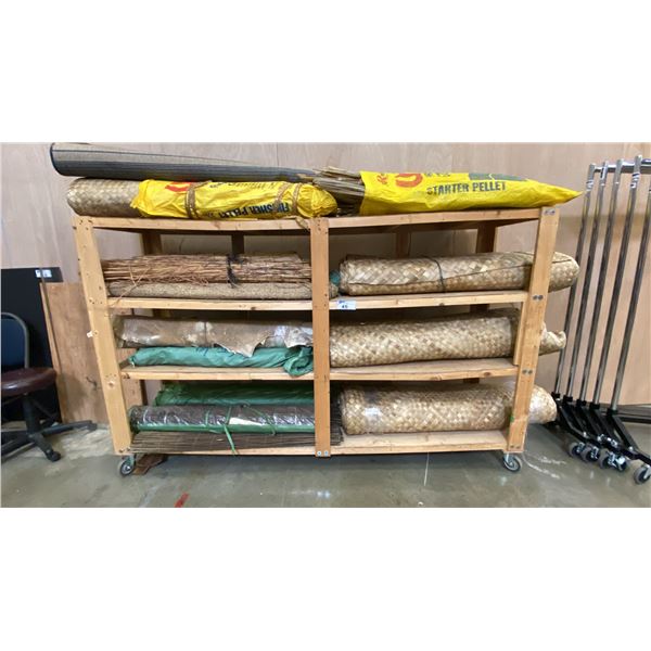 LARGE MOBILE WOODEN STORAGE CART LOADED WITH GRASS, STICK AND HIDE FLOOR MATS AND COVERINGS