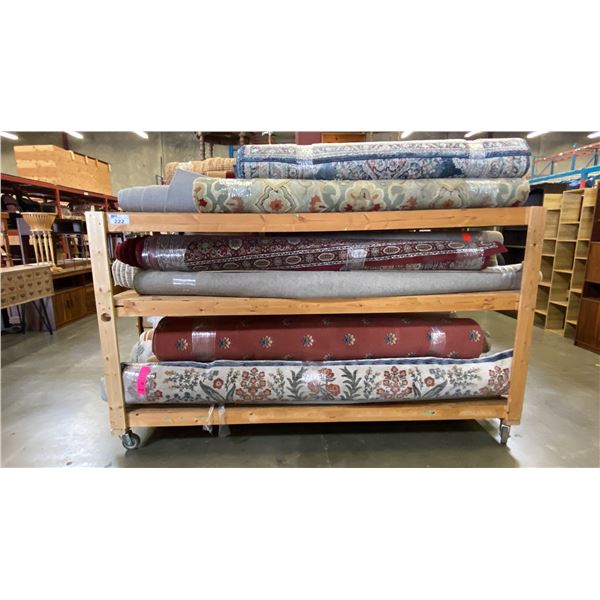 WOODEN MOBILE SHELF UNIT LOADED WITH ASSORTED AREA RUGS - APPROX. 23 LARGE & MEDIUM SZ. RUGS