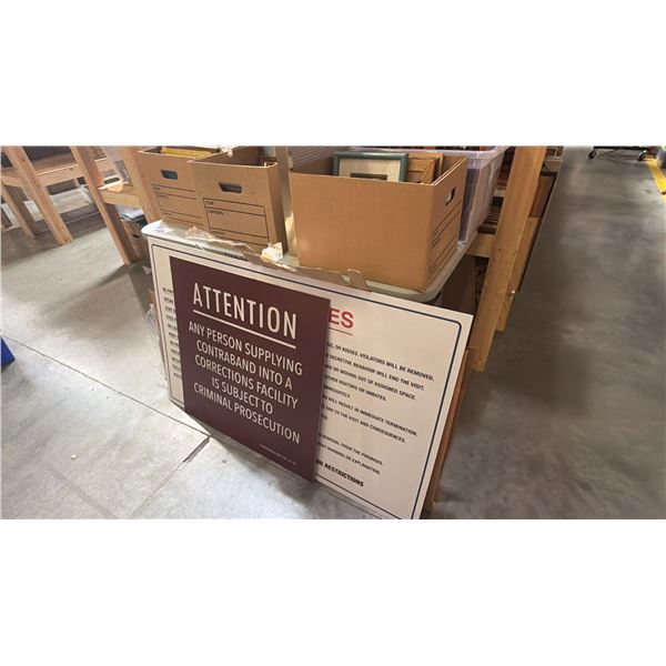 4FT FOLDING TABLE AND CONTENTS - 4 BOXES OF PICTURE FRAMES AND ASSORTED SIGNAGE