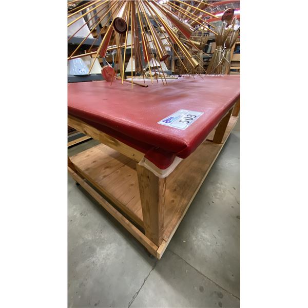 RED VINYL COVERED TOP LARGE MOBILE WOODEN WORK TABLE - APPROX. 8FT X 4FT X 3FT HIGH