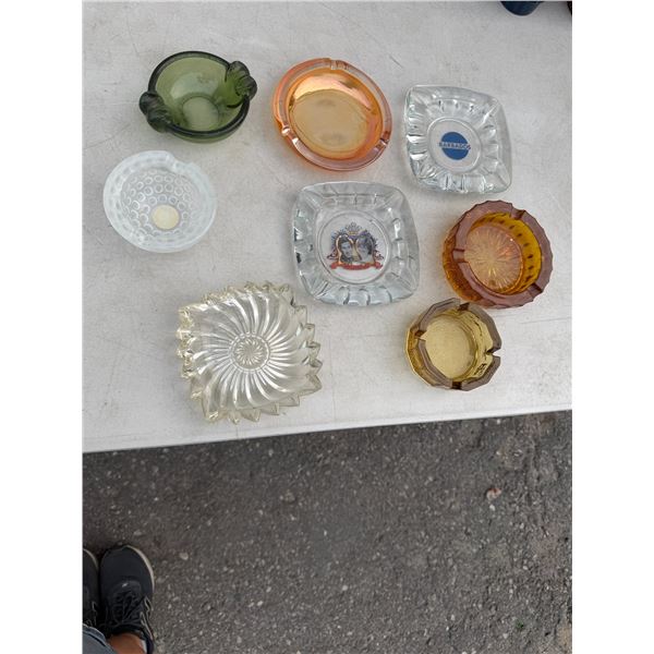 collection features an assortment of mid-20th-century vintage pressed and art glass ashtrays, includ
