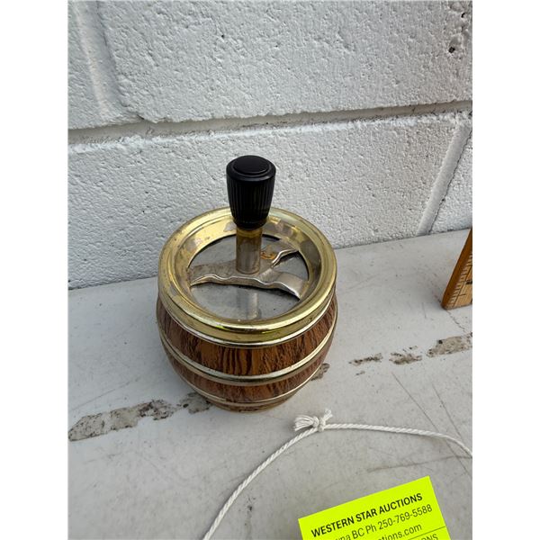vintage push-down spinning ashtray featuring a faux-wood barrel design with brass-tone metal trim an
