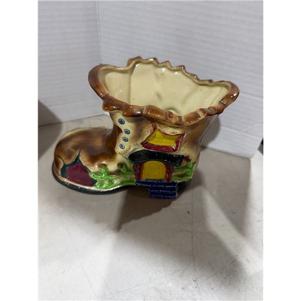 vintage mid-20th-century ceramic boot house planter appears to be a mid-century novelty piece, likel