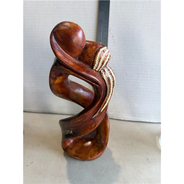 abstract sculpture depicting an embracing or kissing couple pottery