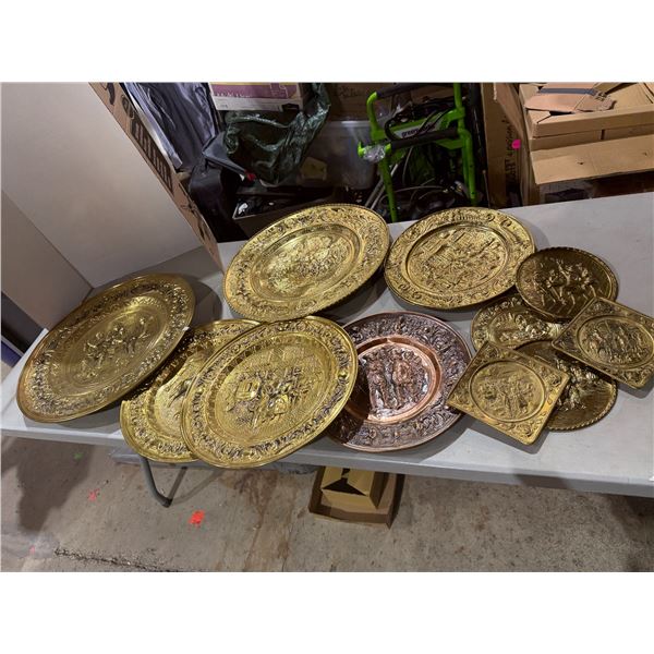 collection of vintage mid-century embossed brass and copper wall-hanging plates