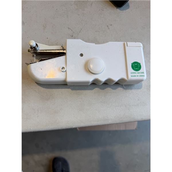 Handheld sewing machine