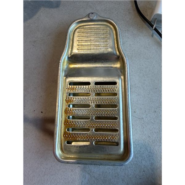 vintage Japanese aluminum kitchen tool is a multi-purpose flat handheld grater