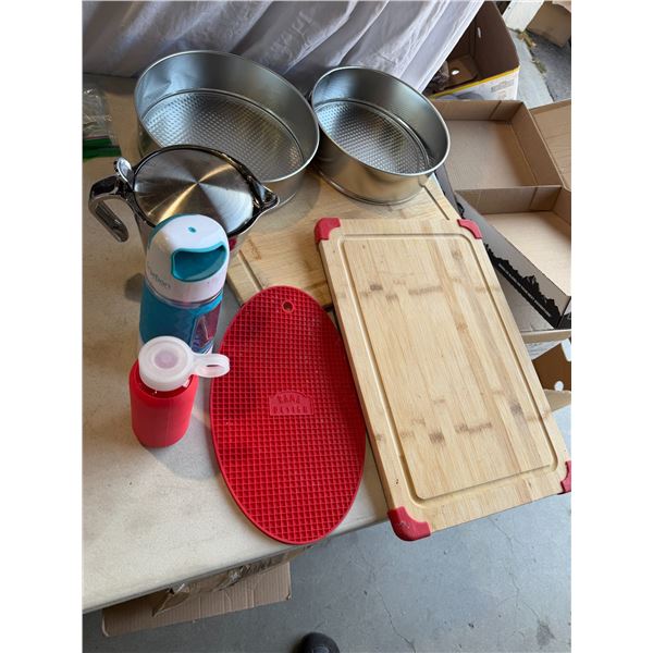 Baking pans, cutting boards, water bottles, water jug