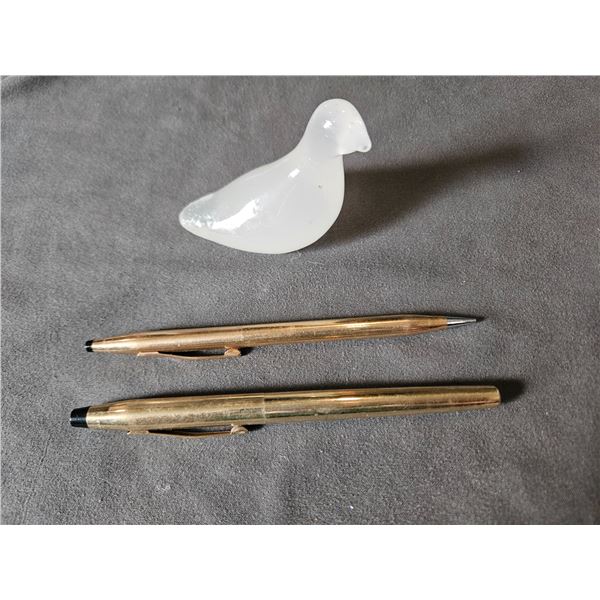 2 pens and bird stone