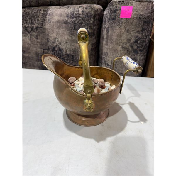 vintage copper and brass coal scuttle featuring blue and white Delft ceramic handle grips