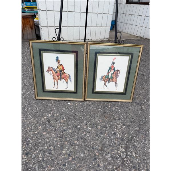 pair of vintage framed color prints depicting 19th-century military cavalry officers on horseback