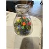 Image 1 : Milk bottle with Vintage marbles