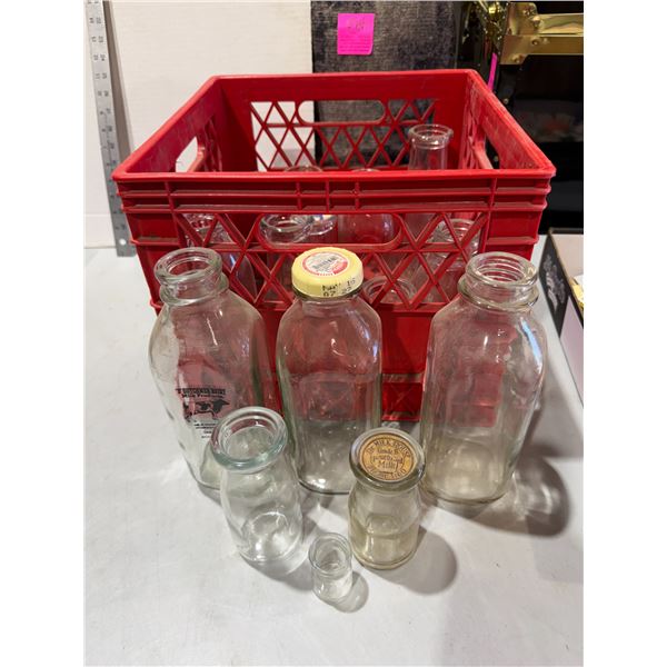 Vintage milk bottles and crate