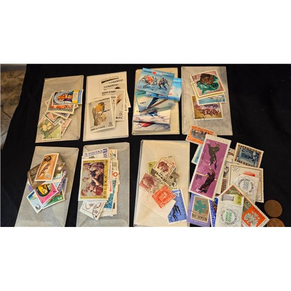 Lot of assorted stamps with plastci case