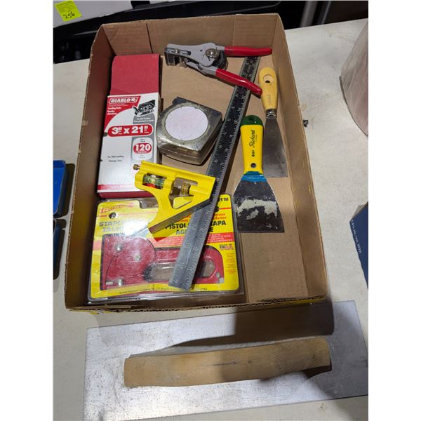 Sandpaper, staple gun, and other tools