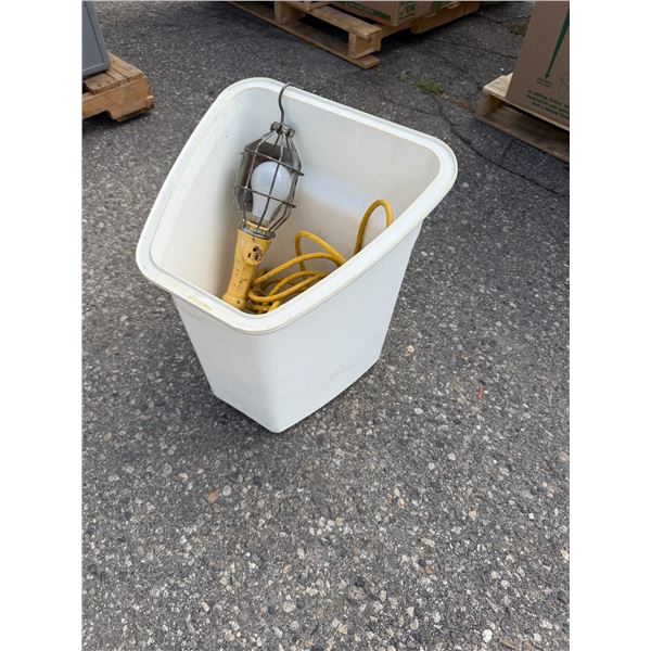 Work light with extension cord and container