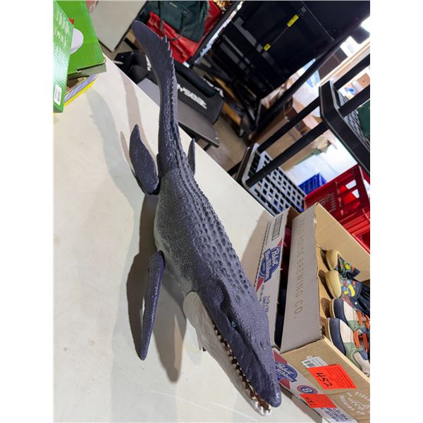 a Jurassic World Ocean Protector Mosasaurus Action Figure