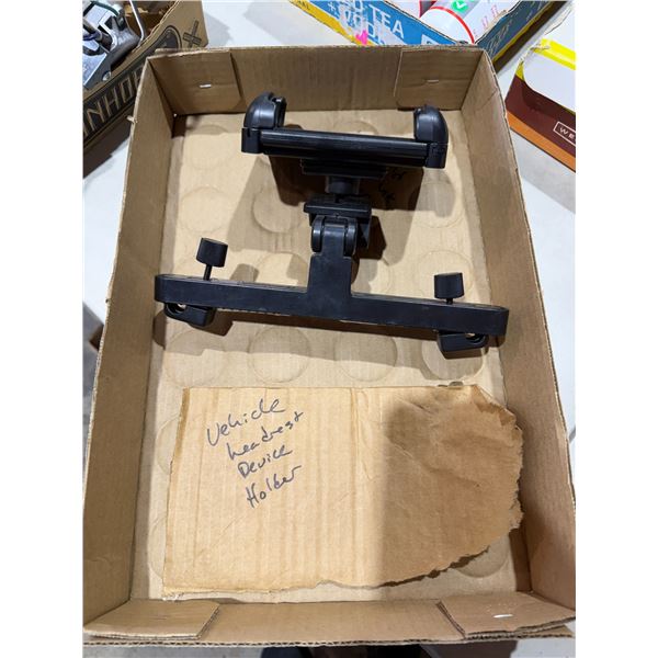 Vehicle headrest device holder