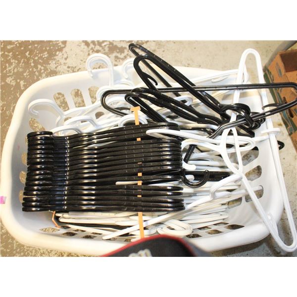 LAUNDRY BASKET FULL OF HANGERS