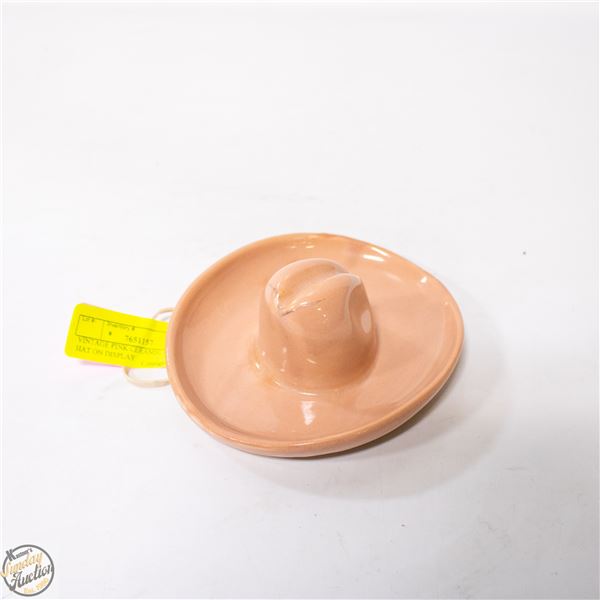 VINTAGE PINK CERAMIC COWBOY HAT ON DISPLAY