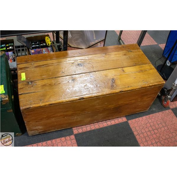 ANCIENT WOODEN STORAGE TRUNK. APPEARS HANDMADE