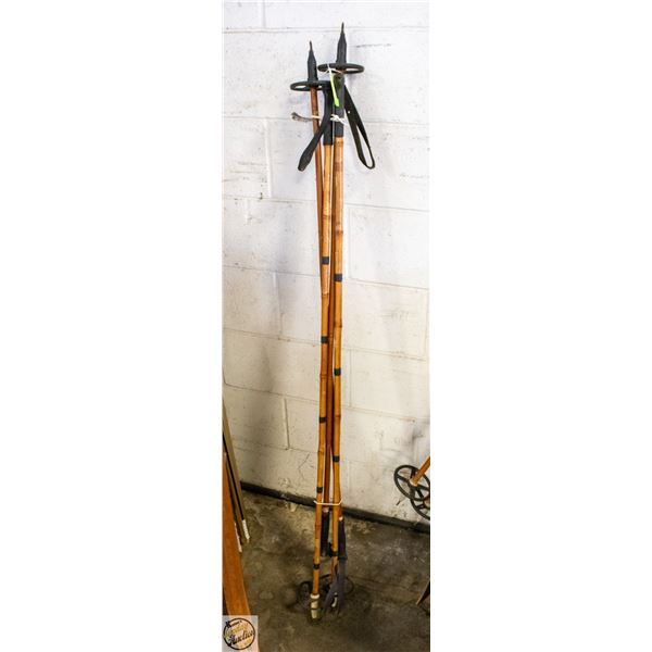 2 PAIRS OF VINTAGE WOODEN SKI POLES.
