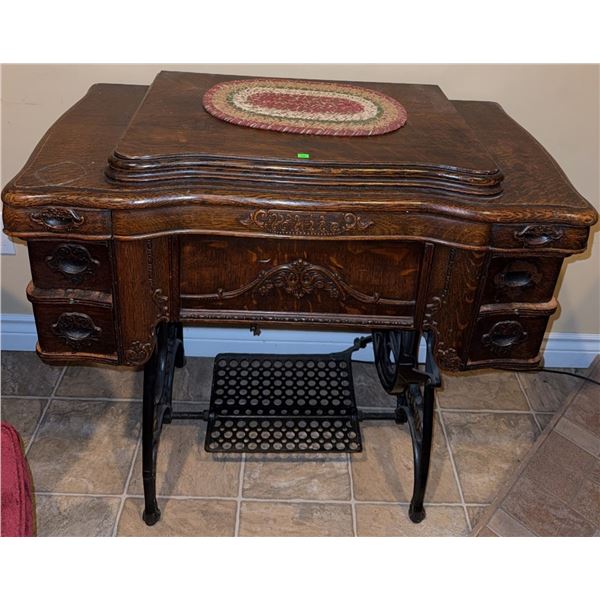 White Treadle Sewing Machine with Ornate Wood Cabinet