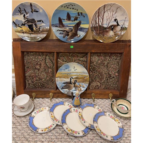Decorative Plates, Teacups, and Wooden Wall Rack
